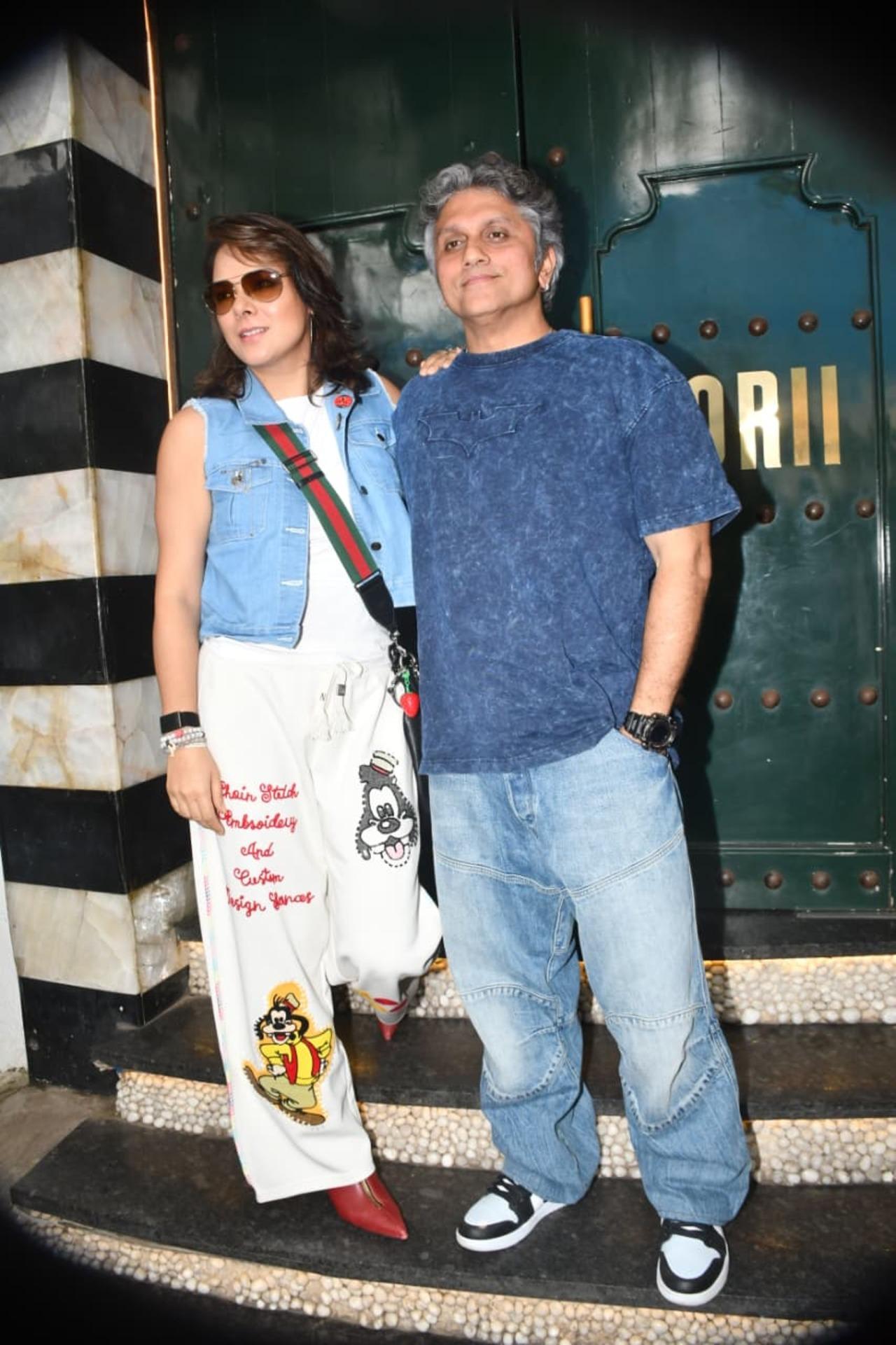 Mohit Suri and his actress-wife kept it trendy and casual for their outing, with Udita rocking a denim vest over cartoon-print track pants and Mohit opting for a blue acid-wash tee with baggy jeans